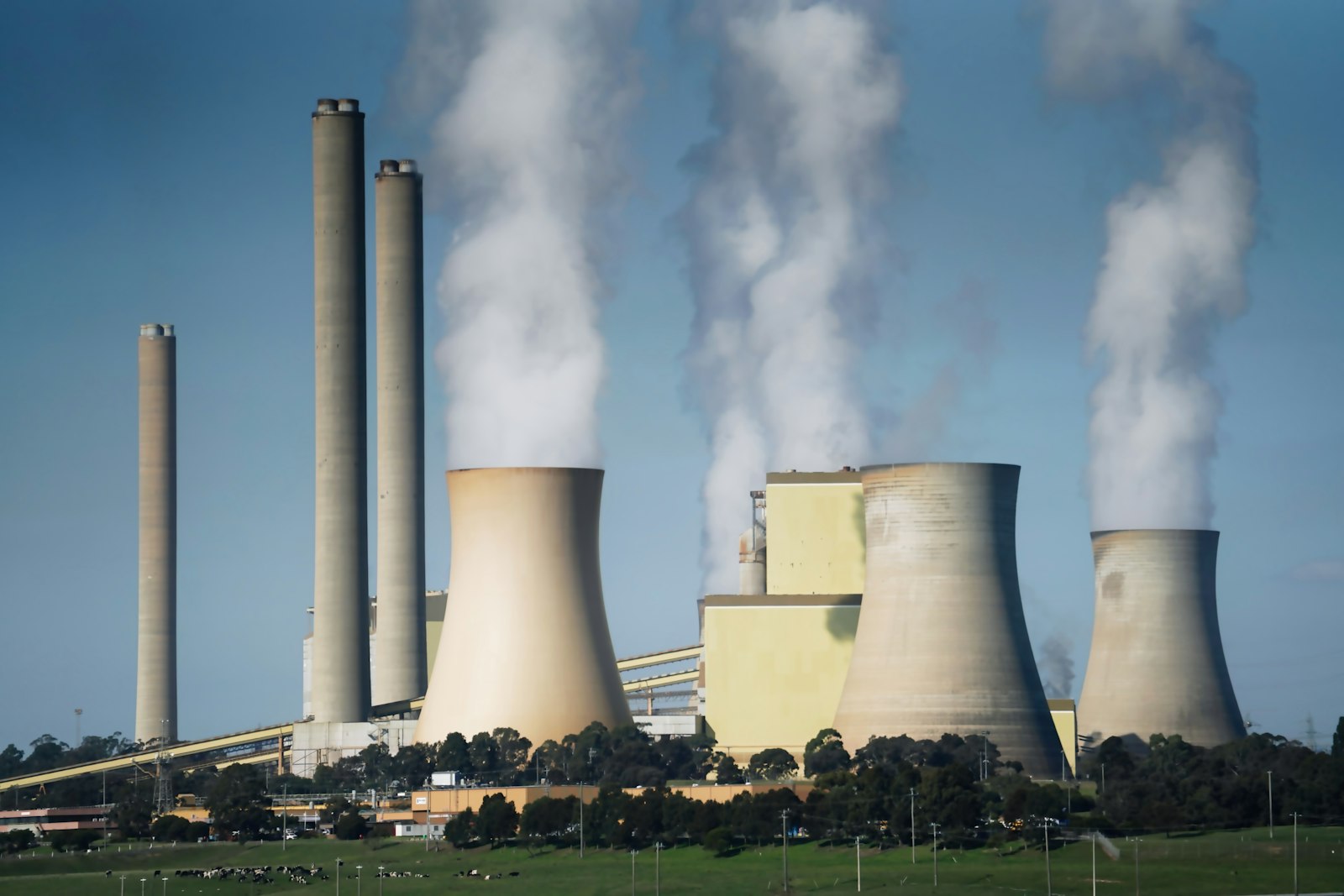 Industrial cooling towers representing greenhouse gas emissions